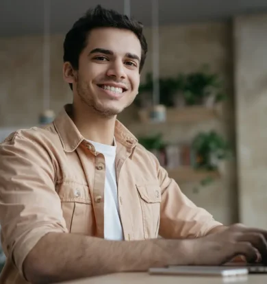 smiling-freelancer-copywriter-using-laptop-working-from-home (1)